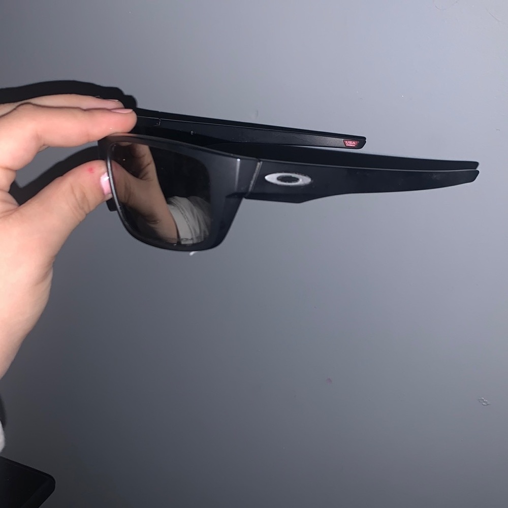 slightly worn Oakleys sunglasses